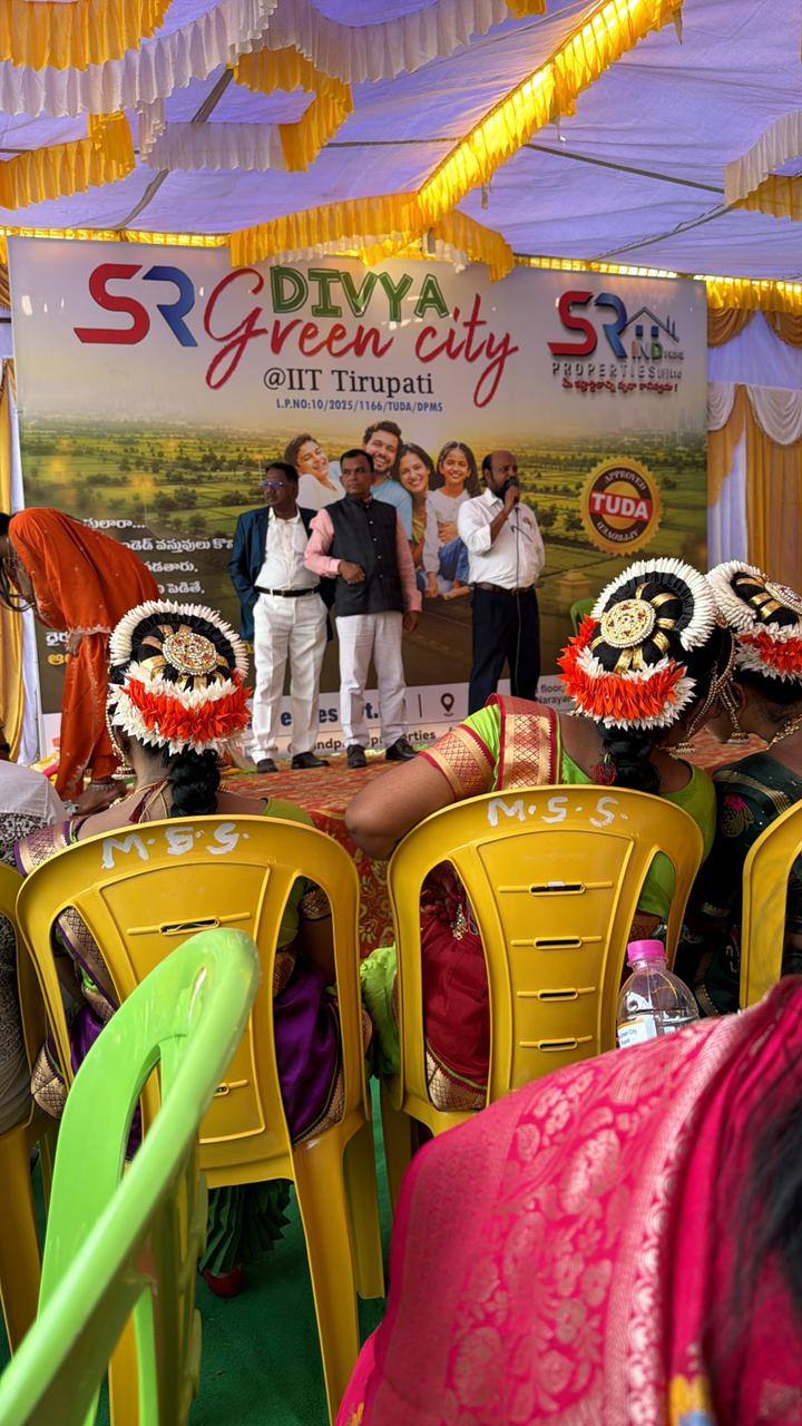 Mega Customer Mela 2026 stage ceremony with SR Divya Green City backdrop at IIT Tirupati